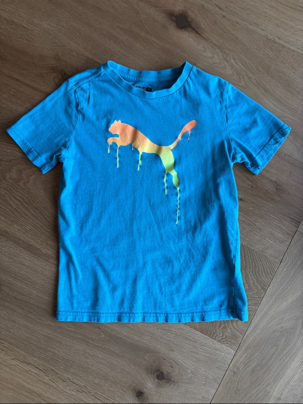 Puma Kids Blue Tee with Orange-Yellow Drip Logo- Unisex
